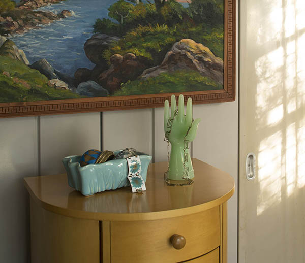 Jewelry armoire with vintage planter and jadeite hand